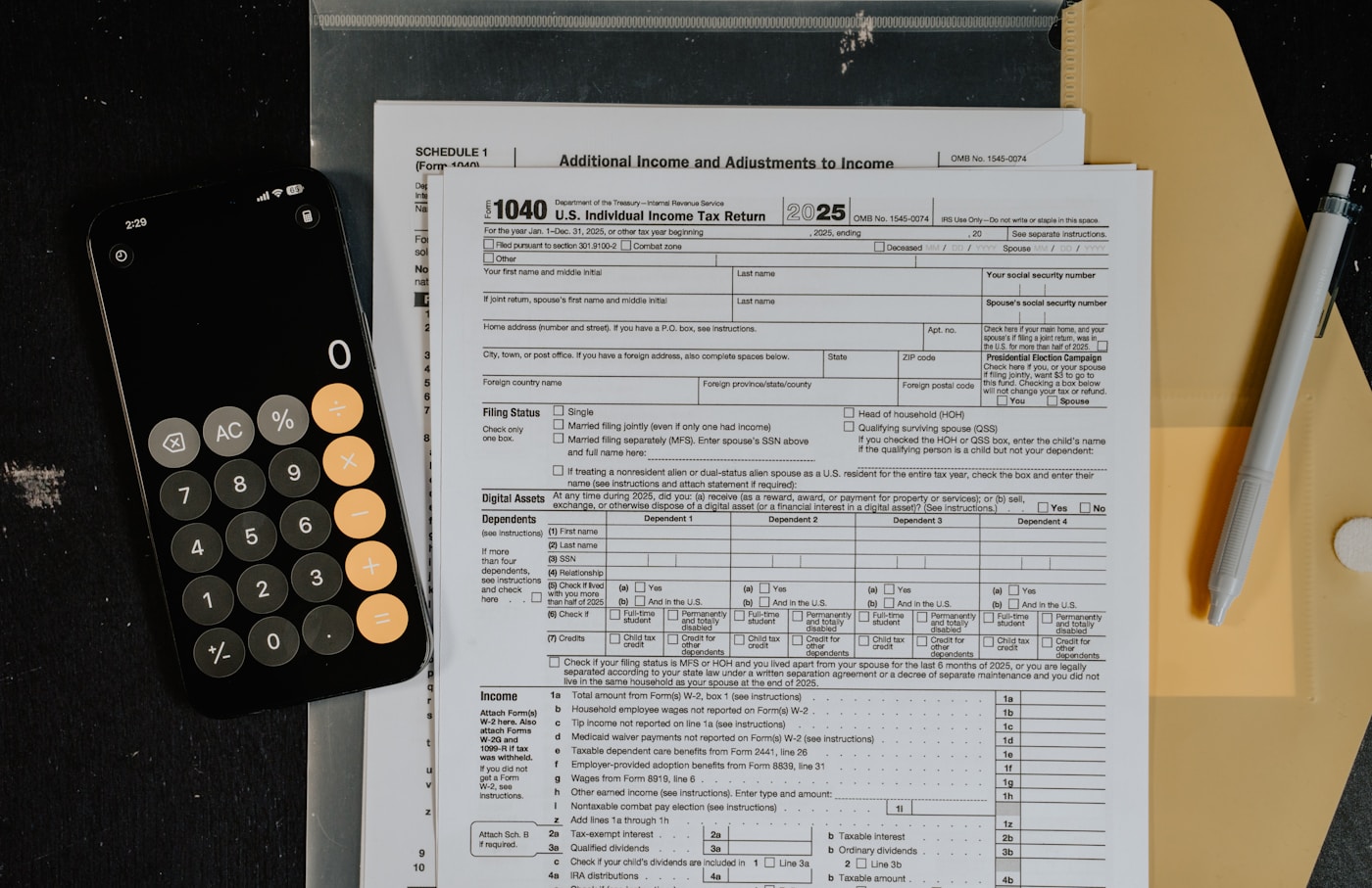Cover image for Can You Buy a Barndominium With Business Income? showing Documentary film photo, interior natural-window-light scene inside a rural live-work barndominium, financial paperwork and calculator on a kitchen table, blurred office and.